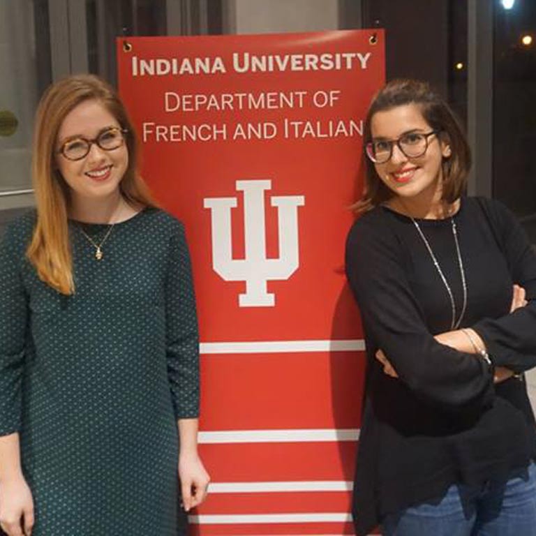 Students pose for photo with IU Department of French and Italian banner.