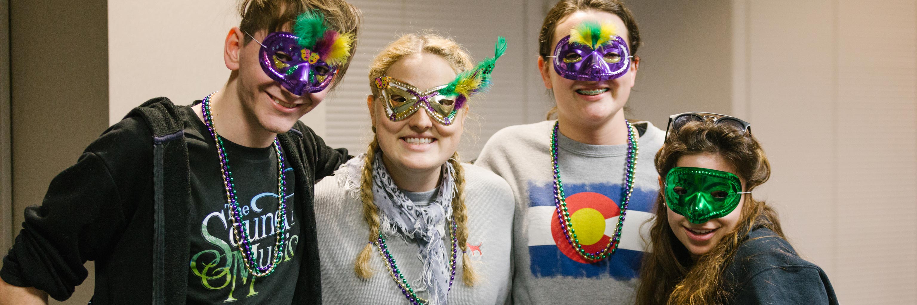 The French Club celebrates Mardi Gras with beads and masks.