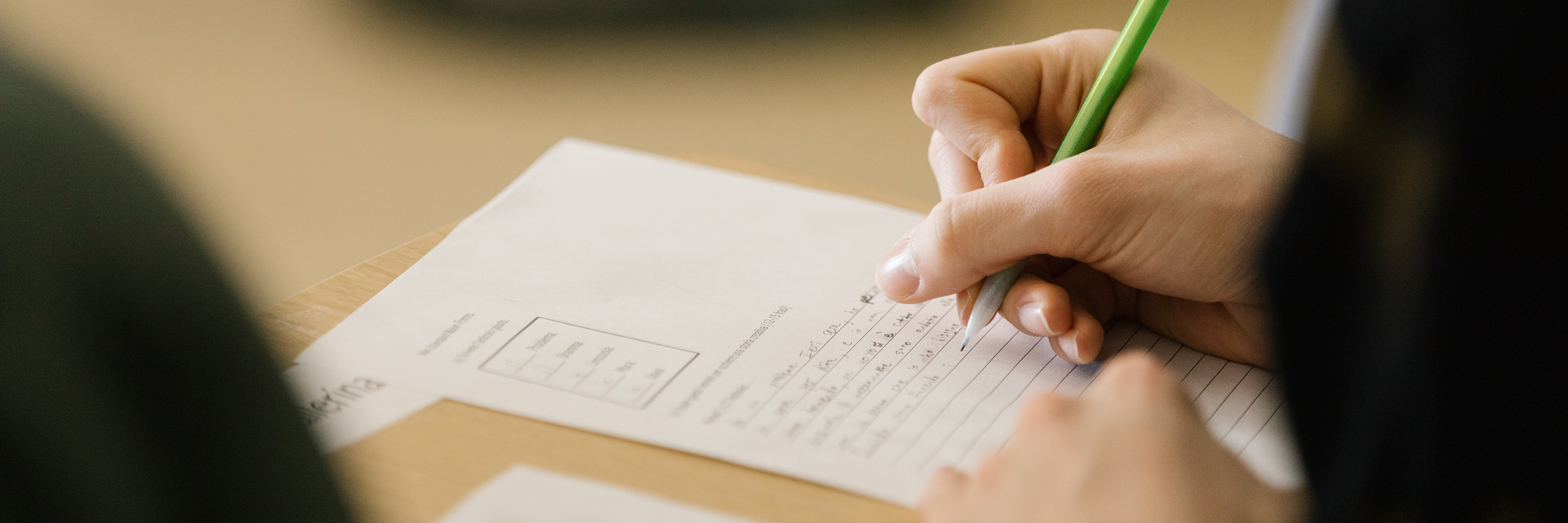 A close-up image of a student completing an assignment. 