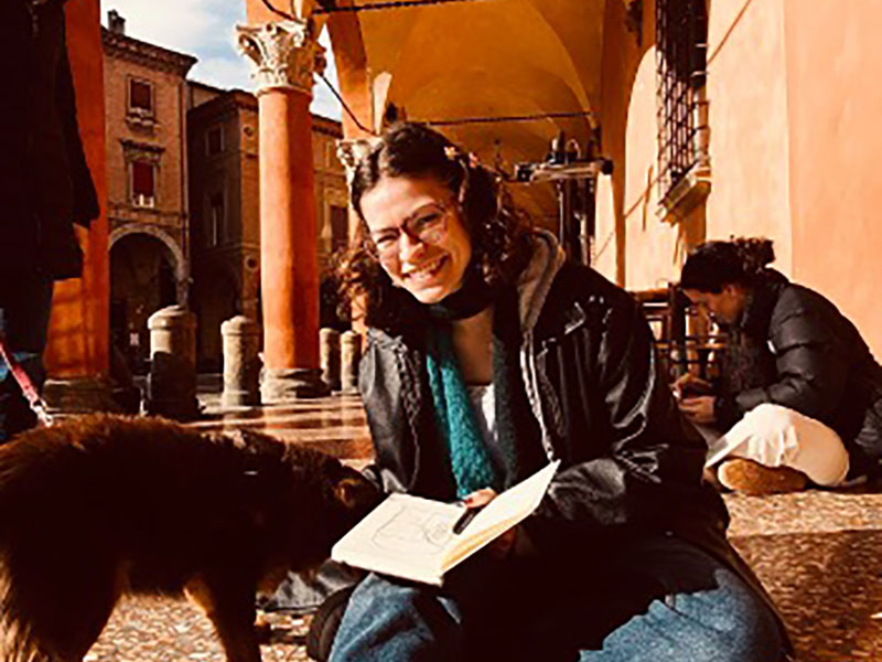 Emily Landsittel enjoying a sunny day under the portici