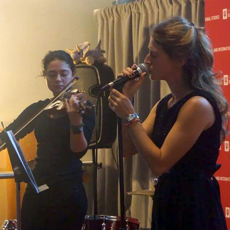 Image of a musical performance from an Italian Club event.